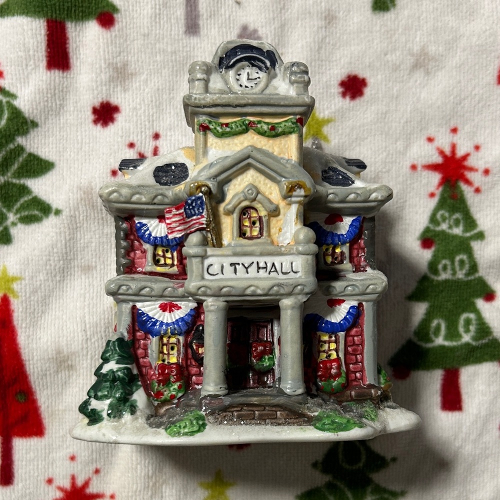 Charming City Hall Holiday Decor with Red and Green Accents